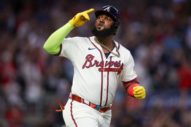 May 28, 2024; Atlanta, Georgia, USA; Atlanta Braves designated hitter Marcell Ozuna (20) celebrates after a home run against the Washington Nationals in the seventh inning at Truist Park. Mandatory Credit: Brett Davis-USA TODAY Sports