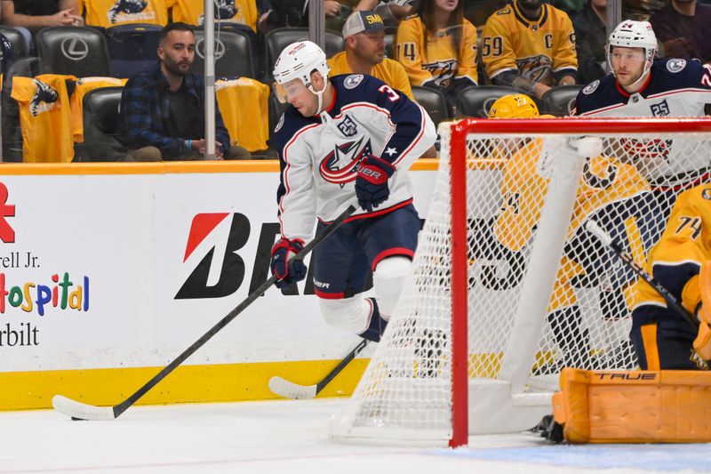 Oct 9, 2025; Nashville, Tennessee, USA; Columbus Blue Jackets center Charlie Coyle (3) skates behind the net against the Nashville Predators during the first period at Bridgestone Arena. Mandatory Credit: Steve Roberts-Imagn Images