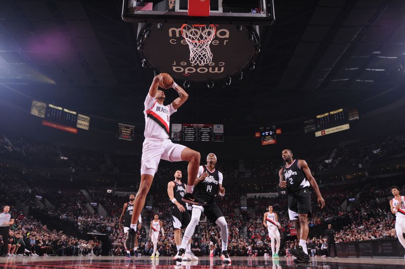 PORTLAND, OR - MARCH 22:  Moses Brown #10 of the Portland Trail Blazers goes to the basket during the game on March 22, 2024 at the Moda Center Arena in Portland, Oregon. NOTE TO USER: User expressly acknowledges and agrees that, by downloading and or using this photograph, user is consenting to the terms and conditions of the Getty Images License Agreement. Mandatory Copyright Notice: Copyright 2024 NBAE (Photo by Cameron Browne/NBAE via Getty Images)