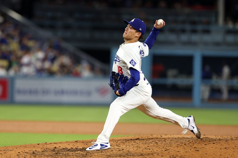 Jun 1, 2024; Los Angeles, California, USA;  Los Angeles Dodgers starting pitcher Yoshinobu Yamamoto (18) pitches during the sixth inning against the Colorado Rockies at Dodger Stadium. Mandatory Credit: Kiyoshi Mio-USA TODAY Sports