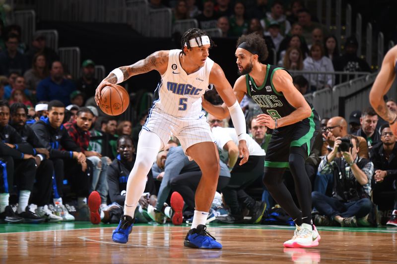 BOSTON, MA - DECEMBER 18: Paolo Banchero #5 of the Orlando Magic dribbles the ball during the game against the Boston Celtics on December 18, 2022 at the TD Garden in Boston, Massachusetts.  NOTE TO USER: User expressly acknowledges and agrees that, by downloading and or using this photograph, User is consenting to the terms and conditions of the Getty Images License Agreement. Mandatory Copyright Notice: Copyright 2022 NBAE  (Photo by Brian Babineau/NBAE via Getty Images)