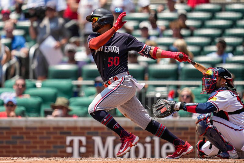 Jun 28, 2023; Cumberland, Georgia, USA; Minnesota Twins left fielder Willi Castro (50) singles against the Atlanta Braves during the seventh inning at Truist Park. Mandatory Credit: Dale Zanine-USA TODAY Sports