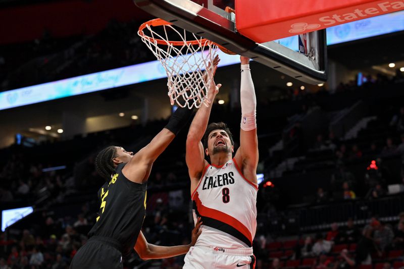 PORTLAND, OREGON - OCTOBER 18: Deni Avdija #8 of the Portland Trail Blazers shoots against Cody Williams #5 of the Utah Jazz during the third quarter of the preseason game at Moda Center on October 18, 2024 in Portland, Oregon. NOTE TO USER: User expressly acknowledges and agrees that, by downloading and or using this photograph, User is consenting to the terms and conditions of the Getty Images License Agreement. (Photo by Alika Jenner/Getty Images)