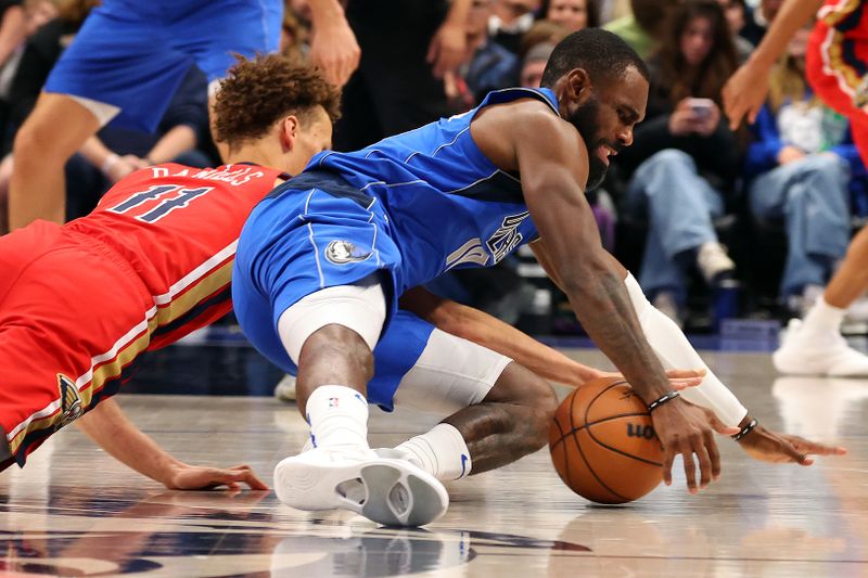 DALLAS, TEXAS - JANUARY 13: Dyson Daniels #11 of the New Orleans Pelicans and Tim Hardaway Jr. #10 of the Dallas Mavericks try for a loose ball in the second half at American Airlines Center on January 13, 2024 in Dallas, Texas. NOTE TO USER: User expressly acknowledges and agrees that, by downloading and or using this photograph, User is consenting to the terms and conditions of the Getty Images License Agreement. (Photo by Richard Rodriguez/Getty Images)