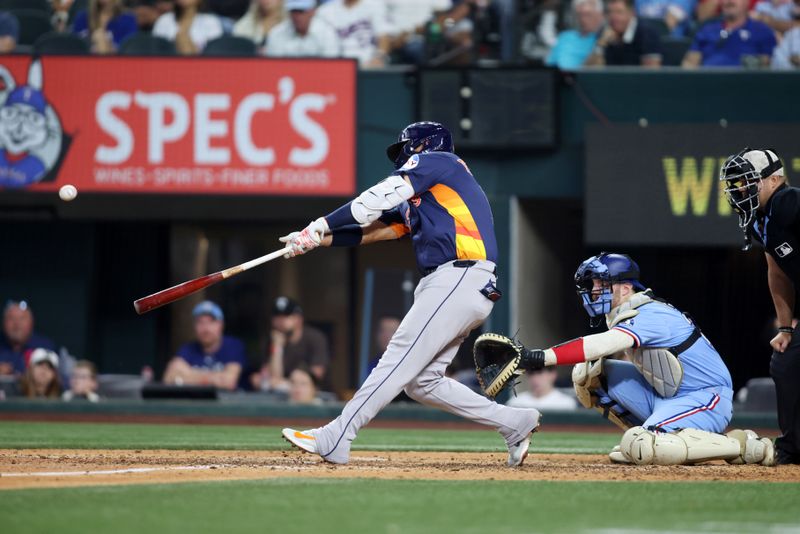 May 18, 2025; Arlington, Texas, USA; Houston Astros third base Isaac Paredes (15) hits a three run home run during the eighth inning against the Texas Rangers at Globe Life Field. Mandatory Credit: Tim Heitman-Imagn Images
