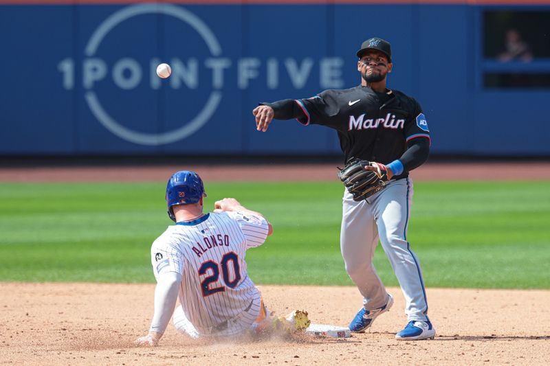 Aug 18, 2024; New York City, New York, USA; Miami Marlins second baseman Otto Lopez (61) forces out New York Mets first baseman Pete Alonso (20) at second base and throws to first to complete the double play on a ball hit by designated hitter J.D. Martinez (not pictured) during the eighth inning at Citi Field. Mandatory Credit: Vincent Carchietta-USA TODAY Sports