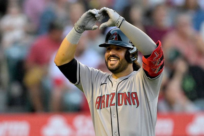 Jul 12, 2025; Anaheim, California, USA;  Arizona Diamondbacks third baseman Eugenio Suarez (28) celebrates after hitting his second solo home run of the game during the fourth inning against the Los Angeles Angels at Angel Stadium. Mandatory Credit: Jayne Kamin-Oncea-Imagn Images
