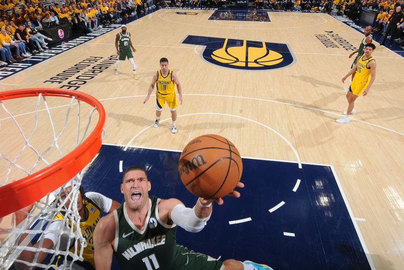 INDIANAPOLIS, IN - APRIL 26:  Brook Lopez #11 of the Milwaukee Bucks drives to the basket during the game against the Indiana Pacers during Round 1 Game 3 of the 2024 NBA Playoffs on April 26, 2024 at Gainbridge Fieldhouse in Indianapolis, Indiana. NOTE TO USER: User expressly acknowledges and agrees that, by downloading and or using this Photograph, user is consenting to the terms and conditions of the Getty Images License Agreement. Mandatory Copyright Notice: Copyright 2024 NBAE (Photo by Ron Hoskins/NBAE via Getty Images)