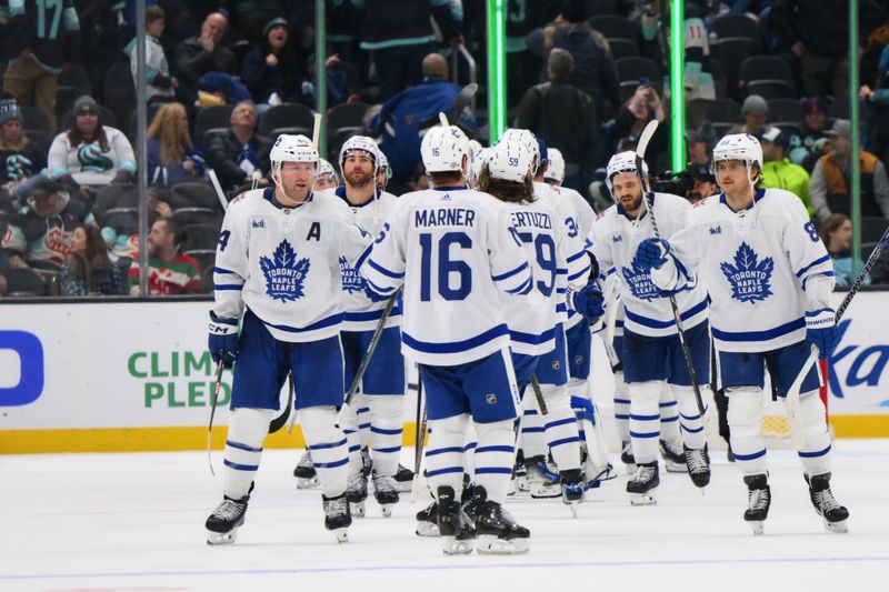 Jan 21, 2024; Seattle, Washington, USA; The Toronto Maple Leafs celebrate after defeating the Seattle Kraken at Climate Pledge Arena. Mandatory Credit: Steven Bisig-USA TODAY Sports