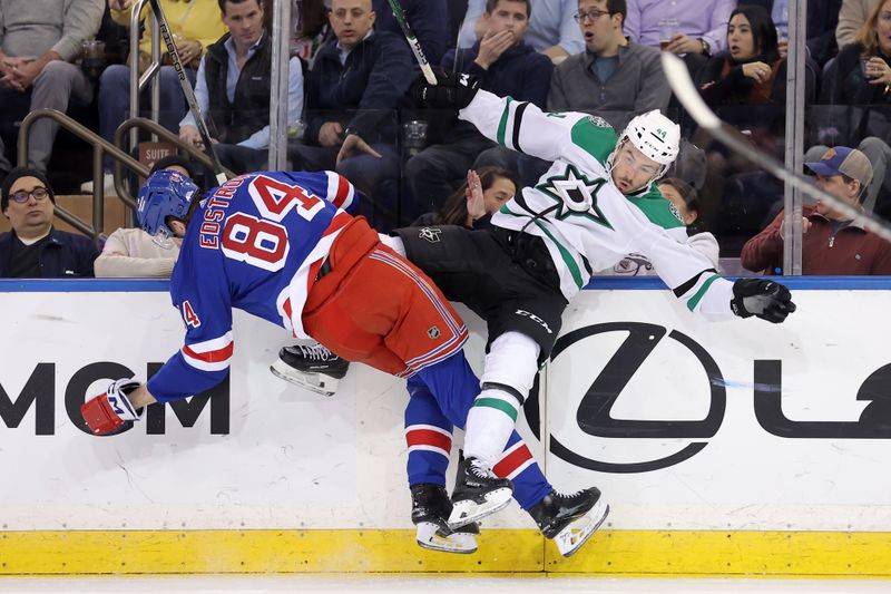 Feb 20, 2024; New York, New York, USA; New York Rangers center Adam Edstrom (84) and Dallas Stars defenseman Joel Hanley (44) collide during the first period at Madison Square Garden. Mandatory Credit: Brad Penner-USA TODAY Sports