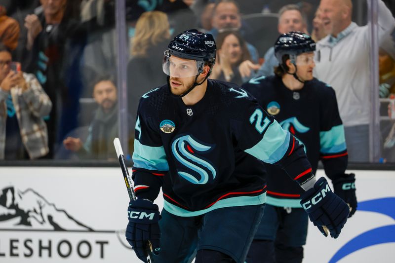 Dec 9, 2023; Seattle, Washington, USA; Seattle Kraken defenseman Jamie Oleksiak (24) celebrates after scoring a goal against the Tampa Bay Lightning during the second period at Climate Pledge Arena. Mandatory Credit: Joe Nicholson-USA TODAY Sports