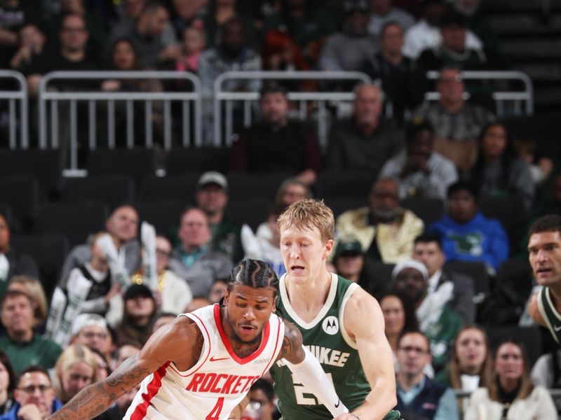 MILWAUKEE, WI - NOVEMBER 18: Jalen Green #4 of the Houston Rockets dribbles the ball during the game against the Milwaukee Bucks on November 18, 2024 at the Fiserv Forum Center in Milwaukee, Wisconsin. NOTE TO USER: User expressly acknowledges and agrees that, by downloading and or using this Photograph, user is consenting to the terms and conditions of the Getty Images License Agreement. Mandatory Copyright Notice: Copyright 2024 NBAE (Photo by Gary Dineen/NBAE via Getty Images).