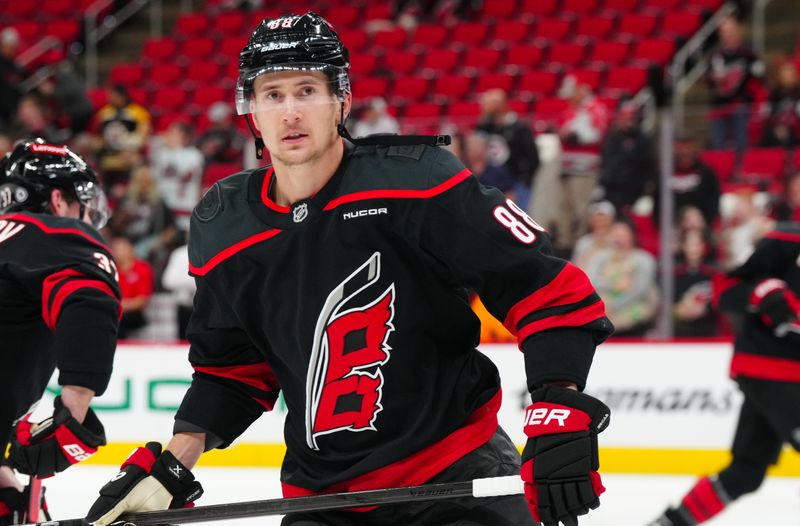 Oct 31, 2024; Raleigh, North Carolina, USA;  Carolina Hurricanes center Martin Necas (88) skates before the game during the warmups against the Boston Bruins at Lenovo Center. Mandatory Credit: James Guillory-Imagn Images