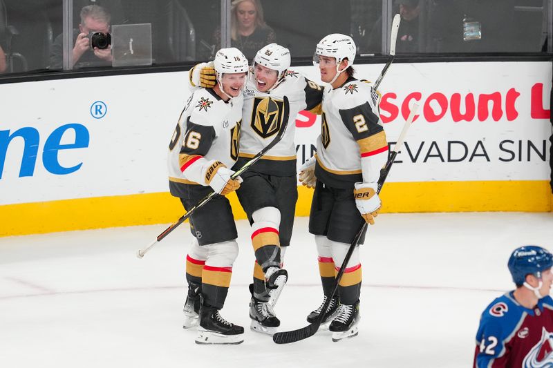 Oct 31, 2025; Las Vegas, Nevada, USA; Vegas Golden Knights right wing Mitch Marner (93) celebrates with right wing Pavel Dorofeyev (16) and defenseman Zach Whitecloud (2) after scoring a goal against the Colorado Avalanche during the third period at T-Mobile Arena. Mandatory Credit: Stephen R. Sylvanie-Imagn Images