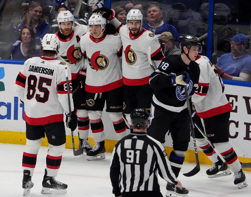 Feb 19, 2024; Tampa, Florida, USA; Ottawa Senators center Tim Stutzle (18) celebrates after scoring against the Tampa Bay Lightning during the first period at Amalie Arena. Mandatory Credit: Dave Nelson-USA TODAY Sports