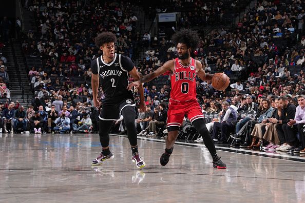 BROOKLYN, NY - NOVEMBER 26: Coby White #0 of the Chicago Bulls drives to the basket during the game against the Brooklyn Nets on November 26, 2023 at Barclays Center in Brooklyn, New York. NOTE TO USER: User expressly acknowledges and agrees that, by downloading and or using this Photograph, user is consenting to the terms and conditions of the Getty Images License Agreement. Mandatory Copyright Notice: Copyright 2023 NBAE (Photo by Jesse D. Garrabrant/NBAE via Getty Images)