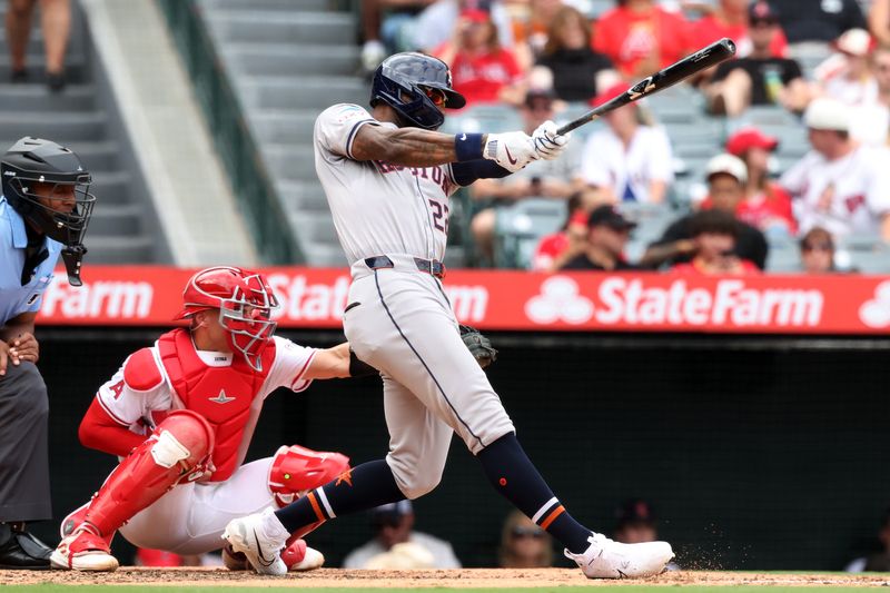 Sep 15, 2024; Anaheim, California, USA;  Houston Astros left fielder Jason Heyward (22) hits an RBI single during the fourth inning against the Los Angeles Angels at Angel Stadium. Mandatory Credit: Kiyoshi Mio-Imagn Images