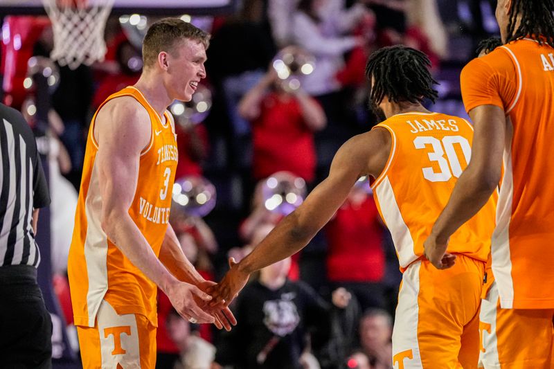 Jan 13, 2024; Athens, Georgia, USA; Tennessee Volunteers guard Dalton Knecht (3) reacts with guard Josiah-Jordan James (30)  after defeating the Georgia Bulldogs at Stegeman Coliseum. Mandatory Credit: Dale Zanine-USA TODAY Sports