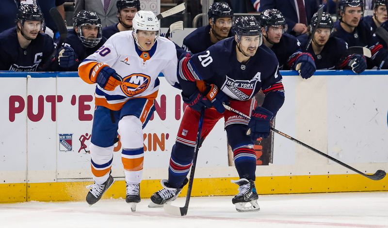 Nov 3, 2024; New York, New York, USA; New York Islanders right wing Hudson Fasching (20) and New York Rangers left wing Chris Kreider (20) skate up ice during the second period at Madison Square Garden. Mandatory Credit: Danny Wild-Imagn Images