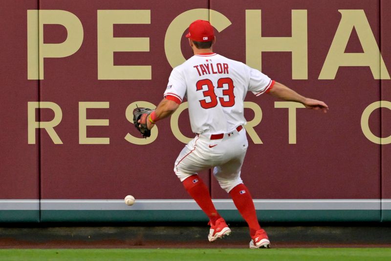 May 26, 2025; Anaheim, California, USA;  Los Angeles Angels center fielder Chris Taylor (33) chases down a three-run double by New York Yankees shortstop Anthony Volpe (11) in the fourth inning at Angel Stadium. Mandatory Credit: Jayne Kamin-Oncea-Imagn Images