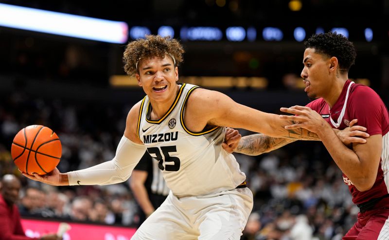 Jan 31, 2024; Columbia, Missouri, USA; Missouri Tigers forward Noah Carter (35) receives a pass against Arkansas Razorbacks forward Jalen Graham (11) during the first half at Mizzou Arena. Mandatory Credit: Jay Biggerstaff-USA TODAY Sports