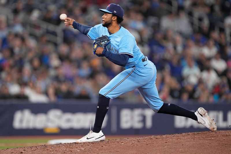 May 4, 2025; Toronto, Ontario, CAN; Toronto Blue Jays pitcher Dillon Tate (9) pitches to the Cleveland Guardians during the seventh inning at Rogers Centre. Mandatory Credit: John E. Sokolowski-Imagn Images