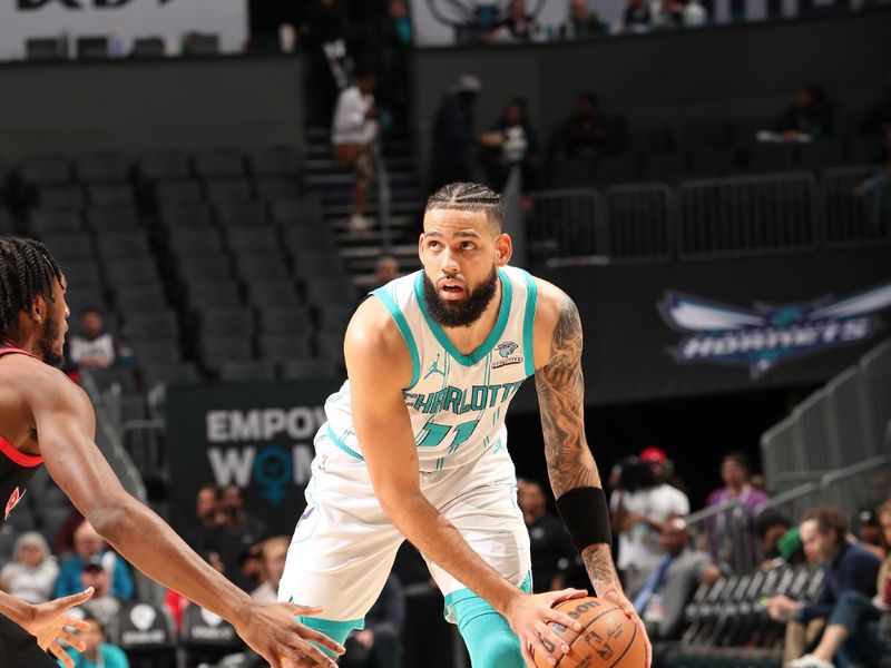 CHARLOTTE, NC - JANUARY 1: Cody Martin #11 of the Charlotte Hornets handles the ball during the game against the Toronto Raptors on January 1, 2024 at Spectrum Center in Charlotte, North Carolina. NOTE TO USER: User expressly acknowledges and agrees that, by downloading and or using this photograph, User is consenting to the terms and conditions of the Getty Images License Agreement. Mandatory Copyright Notice: Copyright 2024 NBAE (Photo by Kent Smith/NBAE via Getty Images)