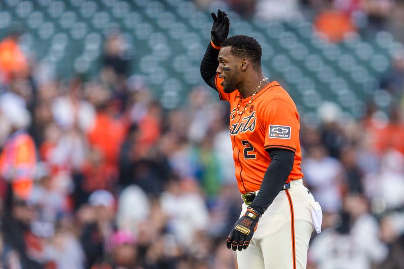 Jul 12, 2024; San Francisco, California, USA; San Francisco Giants designated hitter Jorge Soler (2) reacts after hitting a triple against the Minnesota Twins during the first inning at Oracle Park. Mandatory Credit: John Hefti-USA TODAY Sports