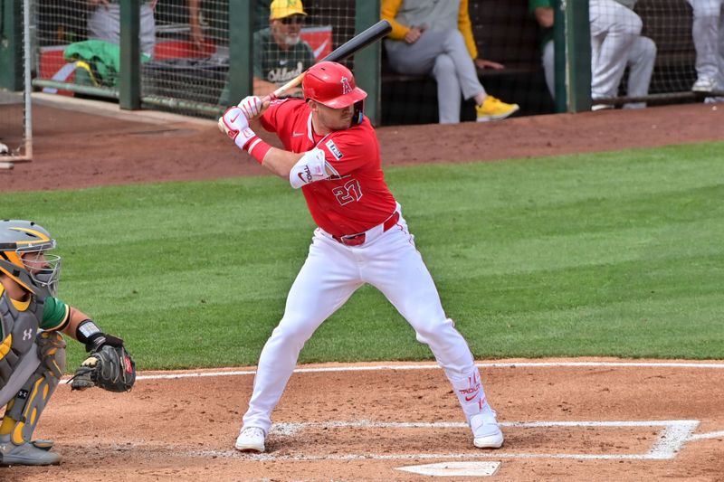 Mar 6, 2024; Tempe, Arizona, USA;  Los Angeles Angels center fielder Mike Trout (27) at bat in the first inning against the Oakland Athletics during a spring training game at Tempe Diablo Stadium. Mandatory Credit: Matt Kartozian-USA TODAY Sports