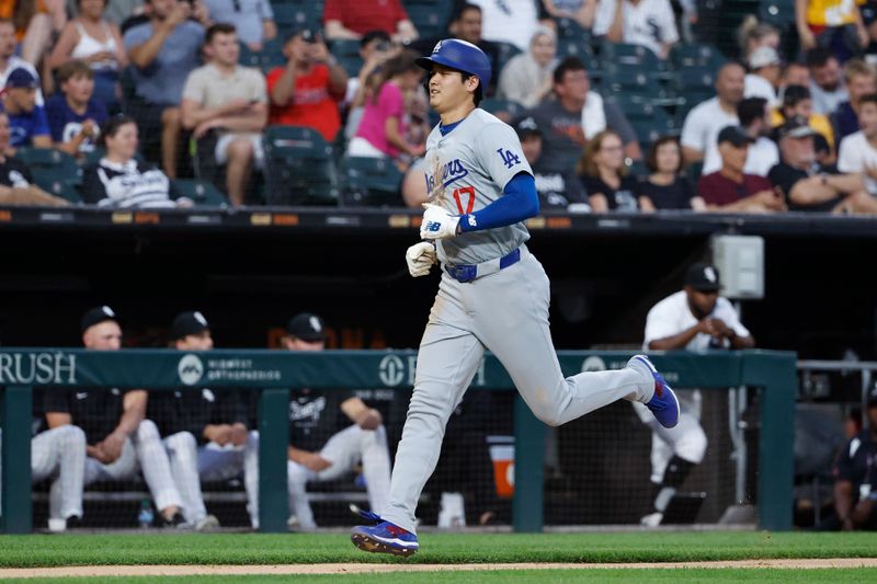 Jun 25, 2024; Chicago, Illinois, USA; Los Angeles Dodgers designated hitter Shohei Ohtani (17) scores a run against the Chicago White Sox during the third inning at Guaranteed Rate Field. Mandatory Credit: Kamil Krzaczynski-USA TODAY Sports