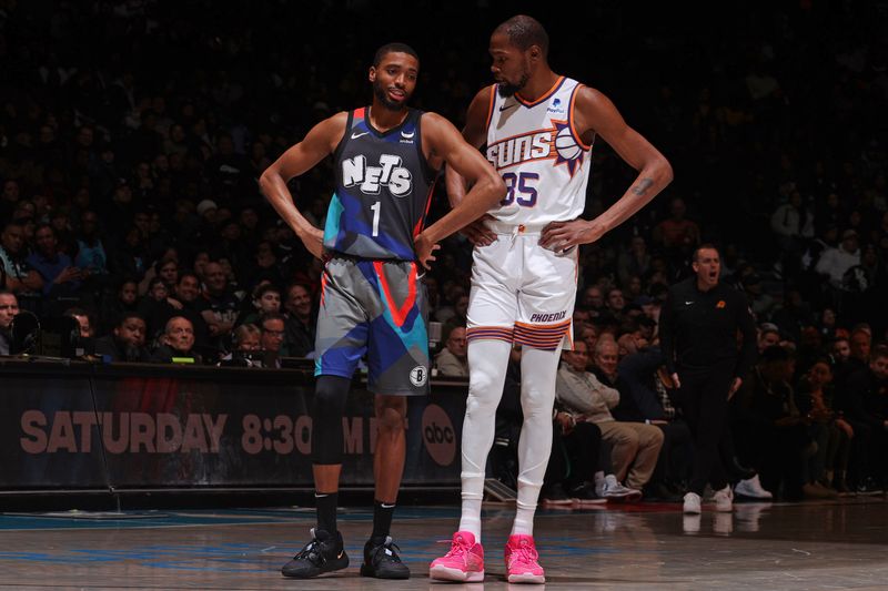 BROOKLYN, NY - JANUARY 31: Kevin Durant #35 of the Phoenix Suns and Mikal Bridges #1 of the Brooklyn Nets talk during the game on January 31, 2024 at Barclays Center in Brooklyn, New York. NOTE TO USER: User expressly acknowledges and agrees that, by downloading and or using this Photograph, user is consenting to the terms and conditions of the Getty Images License Agreement. Mandatory Copyright Notice: Copyright 2024 NBAE (Photo by Nathaniel S. Butler/NBAE via Getty Images)