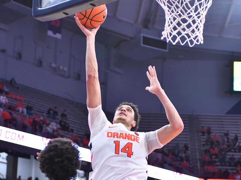 Feb 28, 2023; Syracuse, New York, USA; Syracuse Orange center Jesse Edwards (14) takes a shot over Georgia Tech Yellow Jackets forward Javon Franklin (4) and guard Dallan Coleman (3) in the second half at the JMA Wireless Dome. Mandatory Credit: Mark Konezny-USA TODAY Sports