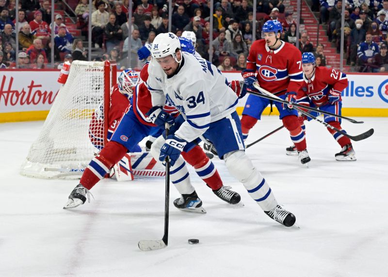 Mar 9, 2024; Montreal, Quebec, CAN: Toronto Maple Leafs forward Auston Matthews (34) plays the puck during the first period of the game against the Montreal Canadiens at the Bell Centre. Mandatory Credit: Eric Bolte-USA TODAY Sports