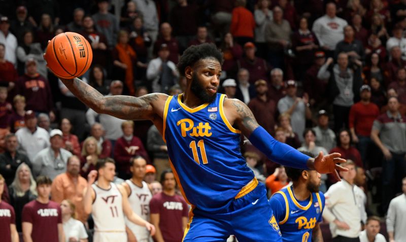 Feb 18, 2023; Blacksburg, Virginia, USA; Pittsburgh Panthers guard Jamarius Burton (11) grabs a one handed rebound against the Virginia Tech Hokies at Cassell Coliseum. Mandatory Credit: Lee Luther Jr.-USA TODAY Sports