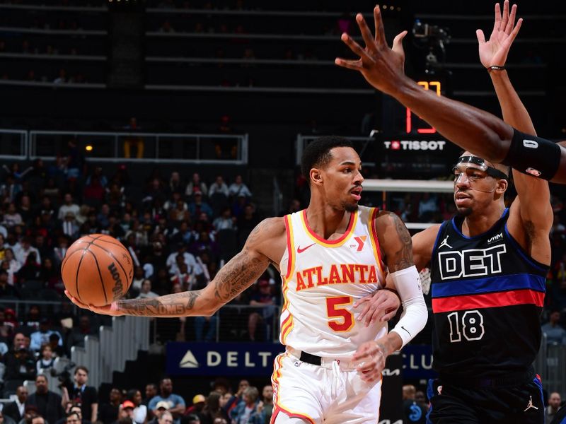 ATLANTA, GA - APRIL 3: Dejounte Murray #5 of the Atlanta Hawks passes the ball during the game against the Detroit Pistons on April 3, 2024 at State Farm Arena in Atlanta, Georgia.  NOTE TO USER: User expressly acknowledges and agrees that, by downloading and/or using this Photograph, user is consenting to the terms and conditions of the Getty Images License Agreement. Mandatory Copyright Notice: Copyright 2024 NBAE (Photo by Scott Cunningham/NBAE via Getty Images)