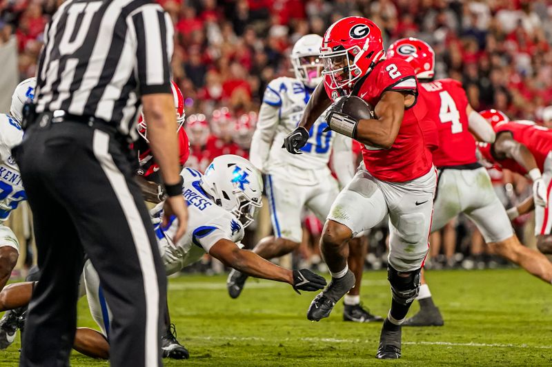 Oct 7, 2023; Athens, Georgia, USA; Georgia Bulldogs running back Kendall Milton (2) runs for a touchdown past Kentucky Wildcats defensive back Zion Childress (11) during the first half at Sanford Stadium. Mandatory Credit: Dale Zanine-USA TODAY Sports