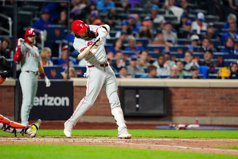 Sep 22, 2024; New York City, New York, USA; Philadelphia Phillies right fielder Nick Castellanos (8) hits a single against the New York Mets during the fourth inning at Citi Field. Mandatory Credit: Gregory Fisher-Imagn Images