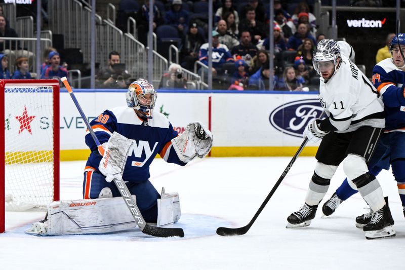 Dec 9, 2023; Elmont, New York, USA; New York Islanders goaltender Ilya Sorokin (30) tends net as Los Angeles Kings center Anze Kopitar (11) looks for a pass during the first period at UBS Arena. Mandatory Credit: John Jones-USA TODAY Sports