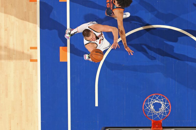 NEW YORK, NY - JANUARY 25: Nikola Jokic #15 of the Denver Nuggets drives to the basket during the game against the New York Knicks on January 25, 2024 at Madison Square Garden in New York City, New York.  NOTE TO USER: User expressly acknowledges and agrees that, by downloading and or using this photograph, User is consenting to the terms and conditions of the Getty Images License Agreement. Mandatory Copyright Notice: Copyright 2024 NBAE  (Photo by Nathaniel S. Butler/NBAE via Getty Images)