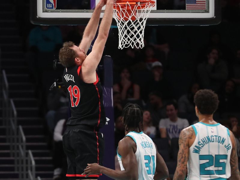 CHARLOTTE, NC - FEBRUARY 7:  Jakob Poeltl #19 of the Toronto Raptors dunks the ball during the game against the Charlotte Hornets on February 7, 2024 at Spectrum Center in Charlotte, North Carolina. NOTE TO USER: User expressly acknowledges and agrees that, by downloading and or using this photograph, User is consenting to the terms and conditions of the Getty Images License Agreement.  Mandatory Copyright Notice:  Copyright 2024 NBAE (Photo by Brock Williams-Smith/NBAE via Getty Images)