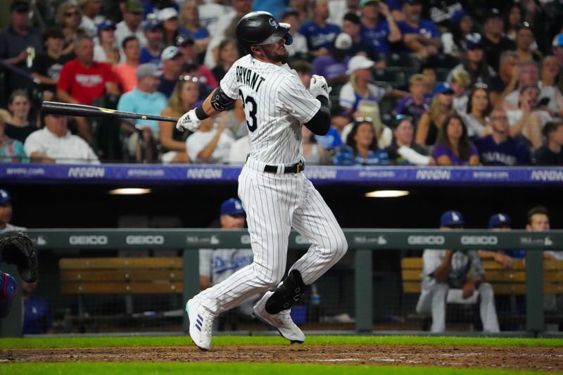 Jul 30, 2022; Denver, Colorado, USA; Colorado Rockies left fielder Kris Bryant (23) singles in the seventh inning against the Los Angeles Dodgers at Coors Field. Mandatory Credit: Ron Chenoy-USA TODAY Sports