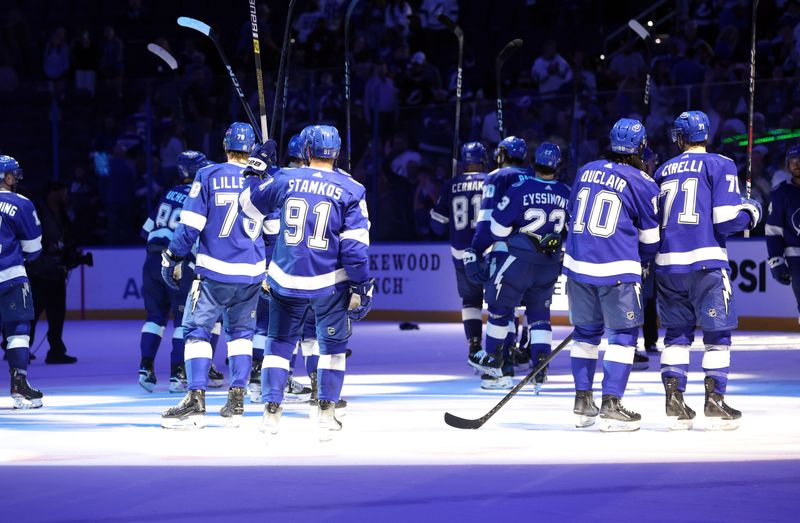 Apr 9, 2024; Tampa, Florida, USA; Tampa Bay Lightning center Steven Stamkos (91) and teammates celebrate after they beat the congratulated at Amalie Arena. Mandatory Credit: Kim Klement Neitzel-USA TODAY Sports