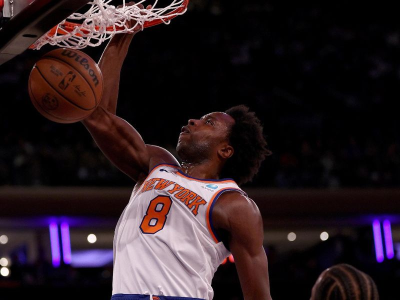 NEW YORK, NEW YORK - JANUARY 03: OG Anunoby #8 of the New York Knicks dunks the ball during the first half as DeMar DeRozan #11 of the Chicago Bulls defends at Madison Square Garden on January 03, 2024 in New York City. NOTE TO USER: User expressly acknowledges and agrees that, by downloading and or using this photograph, User is consenting to the terms and conditions of the Getty Images License Agreement. (Photo by Elsa/Getty Images)