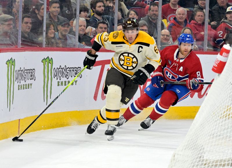 Mar 14, 2024; Montreal, Quebec, CAN; Boston Bruins forward Brad Marchand (63) plays the puck and Montreal Canadiens defenseman Mike Matheson (8) defends during the first period at the Bell Centre. Mandatory Credit: Eric Bolte-USA TODAY Sports