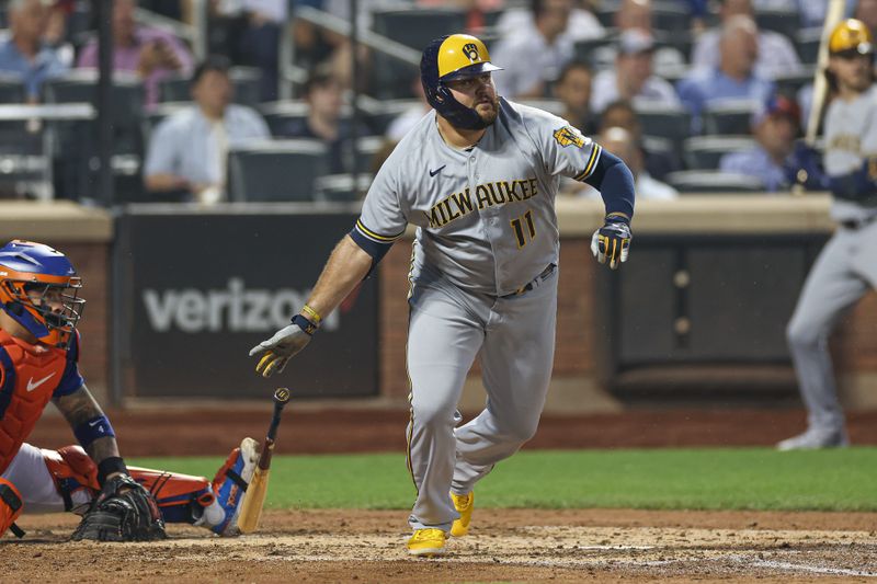 Jun 29, 2023; New York City, New York, USA; Milwaukee Brewers first baseman Rowdy Tellez (11) singles during the sixth inning against the New York Mets at Citi Field. Mandatory Credit: Vincent Carchietta-USA TODAY Sports