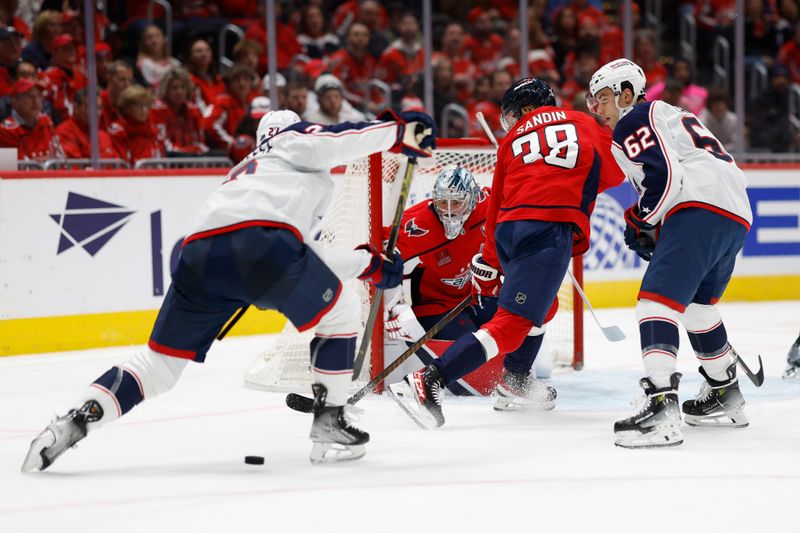 Nov 2, 2024; Washington, District of Columbia, USA; Columbus Blue Jackets center Zachary Aston-Reese (27) shoots the puck on Washington Capitals goaltender Logan Thompson (48) in the second period at Capital One Arena. Mandatory Credit: Geoff Burke-Imagn Images