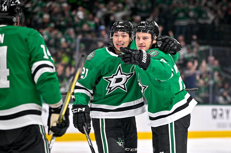 Dec 14, 2024; Dallas, Texas, USA; Dallas Stars left wing Jason Robertson (21) and center Roope Hintz (24) celebrates a goal scored by Robertson against the St. Louis Blues during the second period at American Airlines Center. Mandatory Credit: Jerome Miron-Imagn Images