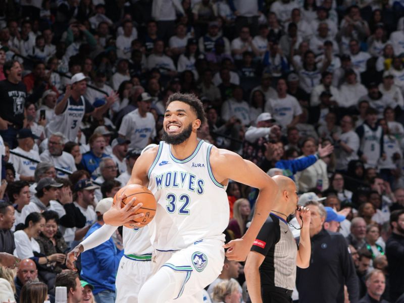 MINNEAPOLIS, MN -  APRIL 20: Karl-Anthony Towns #32 of the Minnesota Timberwolves smiles during Round One Game One of the 2024 NBA Playoffs against the Phoenix Suns on April 20, 2024 at Target Center in Minneapolis, Minnesota. NOTE TO USER: User expressly acknowledges and agrees that, by downloading and or using this Photograph, user is consenting to the terms and conditions of the Getty Images License Agreement. Mandatory Copyright Notice: Copyright 2024 NBAE (Photo by Jordan Johnson/NBAE via Getty Images)