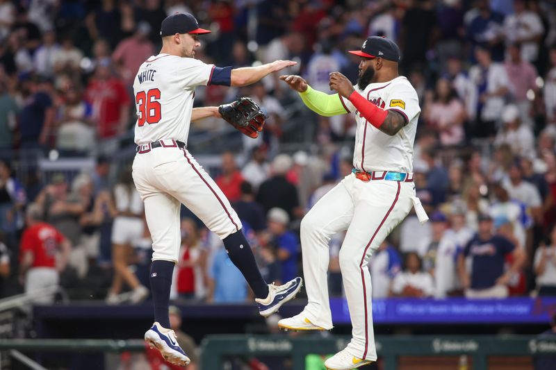 Sep 24, 2024; Atlanta, Georgia, USA; Atlanta Braves left fielder Eli White (36) and designated hitter Marcell Ozuna (20) celebrate after a victory over the New York Mets at Truist Park. Mandatory Credit: Brett Davis-Imagn Images
