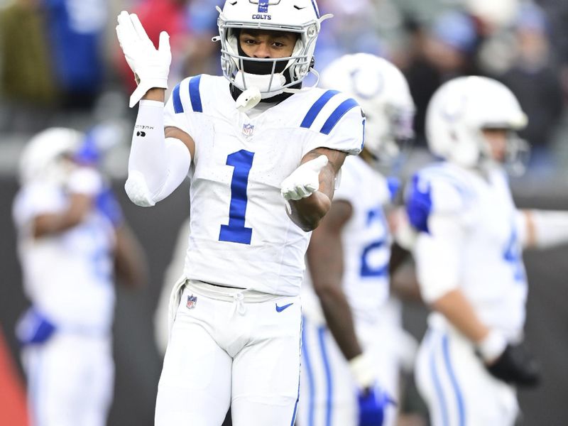 Indianapolis Colts wide receiver Josh Downs (1) claps during warmups before an NFL football game against the Cincinnati Bengals on Sunday, Dec. 10, 2023, in Cincinnati. (AP Photo/Emilee Chinn)